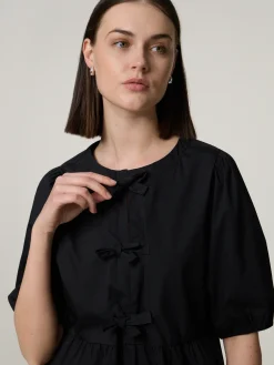 Kurzarmbluse mit Schleifen